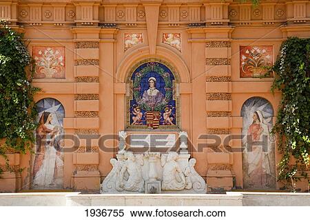 Paintings And Sculpted Artwork Along The Wall Of A Building; Sevilla Andalusia Spain View Large Photo Image Stock Photography - Paintings And Sculpted Artwork Along The Wall Of A Building; Sevilla Andalusia Spain. Fotosearch