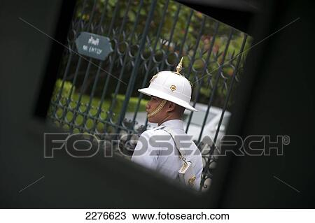 Stock Image - Palace guards on parade, Wat Phra Kaew and the Grand Palace; Bangkok, Thailand. Fotosearch