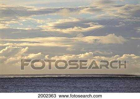 Pale Blue And Yellow Skies With Clouds, Small Surf Breaking Over Reef View Large Photo Image Stock Image - Pale Blue And Yellow Skies With Clouds, Small Surf Breaking Over Reef. Fotosearch