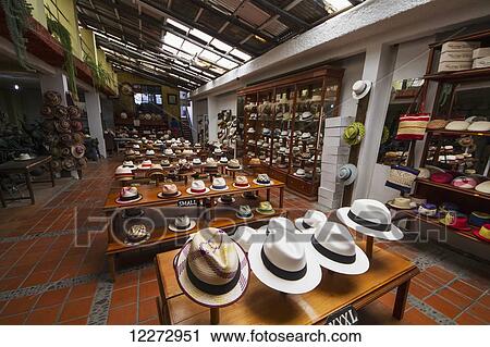Stock Image - Panama hats for sale in the showroom of the Barranco Panama Hat Factory, Cuenca, Azuay, Ecuador. Fotosearch