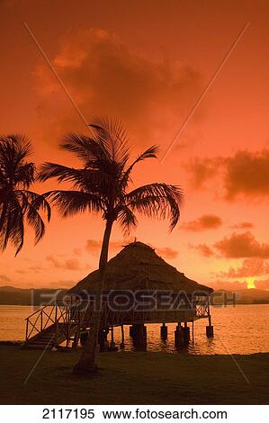 Stock Photography - Panama, San Blas Islands (also called Kuna Yala Islands), Yandup Island, sunrise over the water hut.. Fotosearch