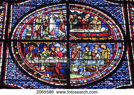 Stock Photograph - Panels Depicting The Funeral Of Lazarus, The Death Of Lazarus & Mary Magdalene Washing The Feet Of Christ In The Mary Magdalene Stained Glass Window In Chartres Cathedral, Chartres, France. Fotosearch