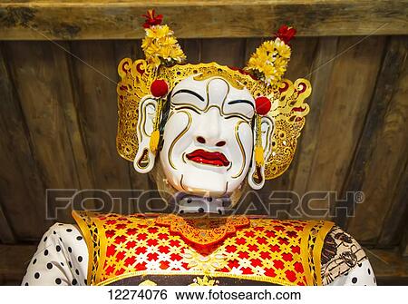 Stock Photograph - Panglembar Balinese dance mask on display at the Setia Darma House of Mask and Puppets, Tegal Bingin, Bali, Indonesia. Fotosearch