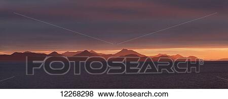 Stock Photo - Panorama of sunrise over Bristol Bay and Ahklun Mountains, Togiak National Wildlife Refuge and Walrus Islands State Game Sanctuary, Round Island, Bristol Bay, Western Alaska, USA.. Fotosearch