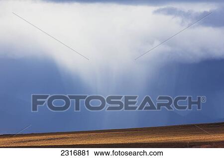 Stock Image - Panoramic Of A Passing Squall Moving Across The Tundra Up Along The Dempster Highway; Yukon Canada. Fotosearch