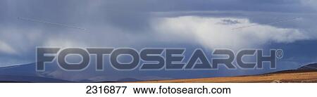 Stock Photo - Panoramic Of A Passing Squall Moving Across The Tundra Up Along The Dempster Highway; Yukon Canada. Fotosearch