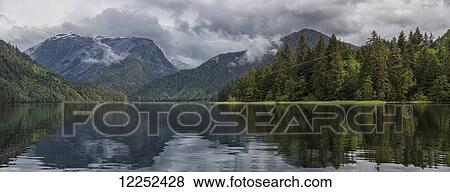 Panoramic view looking into the estuary of the Khutzeymateen Grizzly Bear Sanctuary; British Columbia, Canada View Large Photo Image Stock Photo - Panoramic view looking into the estuary of the Khutzeymateen Grizzly Bear Sanctuary; British Columbia, Canada. Fotosearch