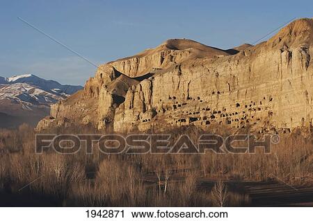 Stock Image - Panoramic View Of Bamiyan And The Escarpment With Hundreds Of Caves, Bamian Province, Afghanistan. Fotosearch