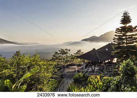 Stock Photograph - Panoramic view of Batur Lake and Mount Agung at sunrise from Kintamani, Bali, Indonesia. Fotosearch
