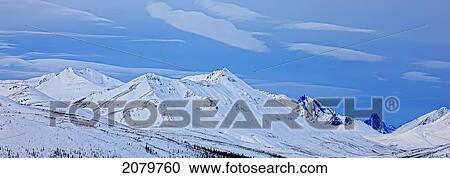Stock Image - Panoramic View Of The Klondike Valley In Winter With Tombstone Mountain In The Distance, Dempster Highway, Yukon.. Fotosearch