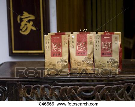 Stock Photograph - Paper Bags With Asian Tea On Table; Yangshuo, China. Fotosearch