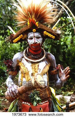 Stock Image - Papua New Guinea, Head Shot Of Young Man, Face With War Paint And Wild Hair. Fotosearch