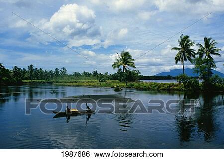 Papua New Guinea, Natives in canoe on scenic lagoon; Hansa Bay View Large Photo Image Stock Photograph - Papua New Guinea, Natives in canoe on scenic lagoon; Hansa Bay. Fotosearch
