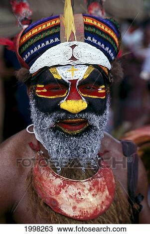 Stock Image - Papua New Guinea, Portrait Of Man In Tribal Dress B1719. Fotosearch