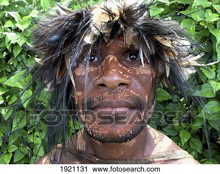 Stock Image - Papua New Guinea, Portrait of Highlander Wearing Headdress; Lae. Fotosearch