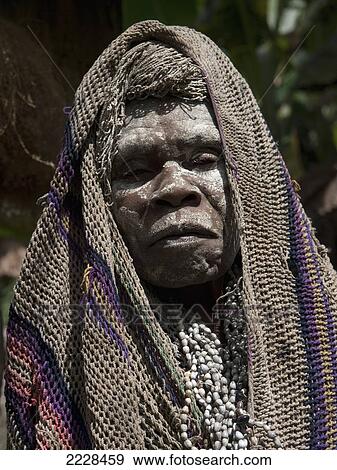 Stock Photo - Papua New Guinea, Tari Valley, Widow; Tigibi Village. Fotosearch