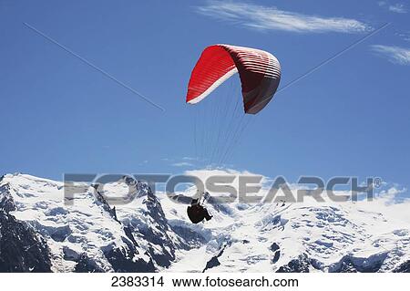 Paraglider above Chamonix-Mont Blanc valley, with Mont Blanc massif mountain range in the background; France View Large Photo Image Picture - Paraglider above Chamonix-Mont Blanc valley, with Mont Blanc massif mountain range in the background; France. Fotosearch