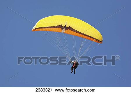Stock Photo - Paraglider above Chamonix-Mont Blanc valley; France. Fotosearch