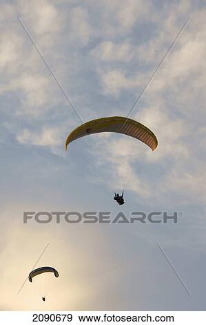 Paragliders Making The Final Descent Over Oludeniz At The Turquoise Coast, Southern Turkey View Large Photo Image Stock Photo - Paragliders Making The Final Descent Over Oludeniz At The Turquoise Coast, Southern Turkey. Fotosearch