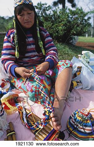 Stock Image - Paraguayan Indian Woman Weaving. Fotosearch