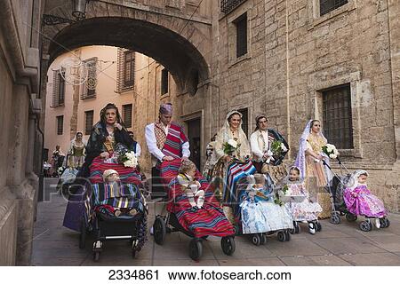 Parents With Babies In Pushchairs Dressed Up In Traditional Casal Faller Outfits With Flower Offering For Virgin De Los Desamparados At Fallas Festival; Valencia, Spain View Large Photo Image Stock Image - Parents With Babies In Pushchairs Dressed Up In Traditional Casal Faller Outfits With Flower Offering For Virgin De Los Desamparados At Fallas Festival; Valencia, Spain. Fotosearch