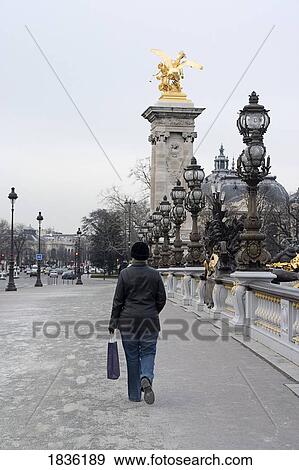 Paris, France; Pedestrian Walking Along Parisian Street View Large Photo Image Stock Photo - Paris, France; Pedestrian Walking Along Parisian Street. Fotosearch