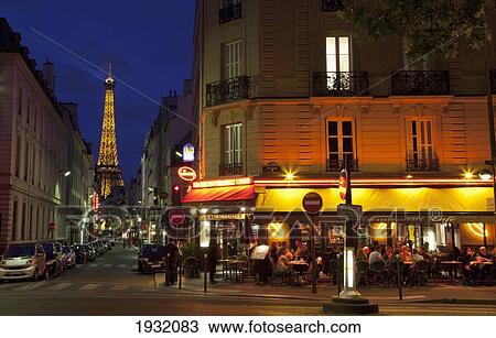 Stock Image - Parisian Cafe And The Eiffel Tower; Central Paris, France, Europe. Fotosearch