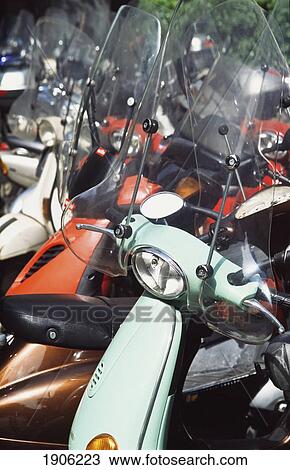 Parked Scooters On A Street In Milan, Italy View Large Photo Image Stock Image - Parked Scooters On A Street In Milan, Italy. Fotosearch