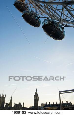 Stock Image - Part Of London Eye With Westminster In Background, London, Uk. Fotosearch