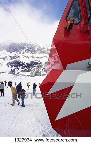 Picture - Part Of Snowcoach, People Walking On Icefield, Alberta, Canada. Fotosearch