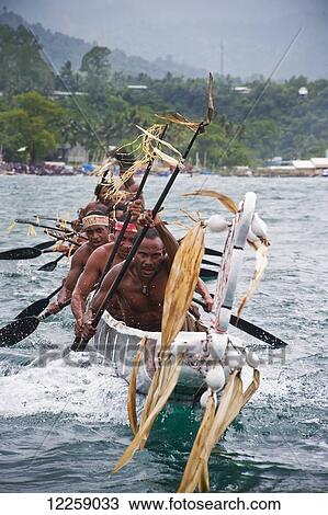 Participants in canoe race at Milne Bay Canoe Festival; Alotau, Milne Bay, Papua New Guinea View Large Photo Image Stock Image - Participants in canoe race at Milne Bay Canoe Festival; Alotau, Milne Bay, Papua New Guinea. Fotosearch