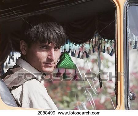 Stock Photo - Pashtun Man Driving A Truck, Khyber Pass, Federally Administered Tribal Areas, Pakistan. Fotosearch