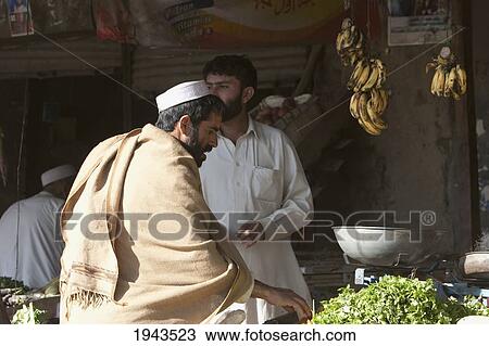Pashtun Men In A Produce Store Along The Torkham To Jalalabad Road, Nangarhar Province, Afghanistan View Large Photo Image Stock Image - Pashtun Men In A Produce Store Along The Torkham To Jalalabad Road, Nangarhar Province, Afghanistan. Fotosearch