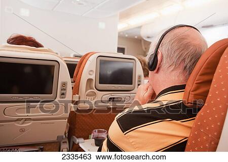 Stock Image - Passenger On Plane; Singapore. Fotosearch