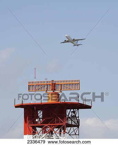 Passenger Plane Flying Over Radar Installation At Malaga Airport; Malaga Province, Spain View Large Photo Image Stock Photo - Passenger Plane Flying Over Radar Installation At Malaga Airport; Malaga Province, Spain. Fotosearch