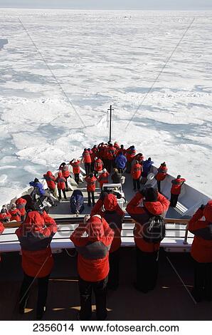 Passengers looking out for polar bears on Silver Explorer; Svalbard, Norway View Large Photo Image Picture - Passengers looking out for polar bears on Silver Explorer; Svalbard, Norway. Fotosearch