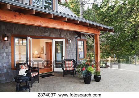 Patio Of West Coast Home; Mayne Island, British Columbia, Canada View Large Photo Image Stock Photo - Patio Of West Coast Home; Mayne Island, British Columbia, Canada. Fotosearch