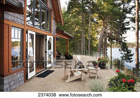 Stock Photo - Patio Of West Coast Home With An Ocean View; Mayne Island, British Columbia, Canada. Fotosearch