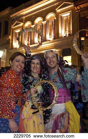 Stock Photography - Patras, Greece: Local Men And Women In Fancy Dress For The Night Parade Of The City's Annual Carnival.. Fotosearch