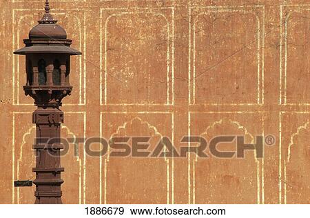 Stock Photo - Patterned Orange Wall And Stone Lantern, Close Up. Fotosearch