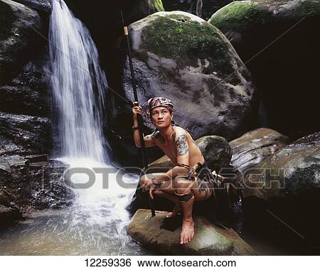 Pausing by a waterfall, near Kuching; Sarawak View Large Photo Image Stock Photograph - Pausing by a waterfall, near Kuching; Sarawak. Fotosearch