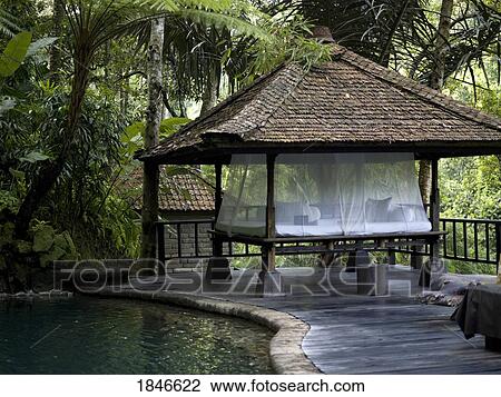 Stock Image - Pavilion By Pond In Forest; Bali, Indonesia. Fotosearch