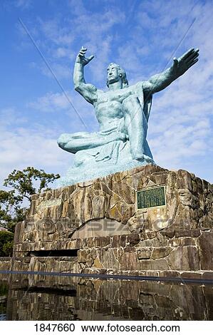 Stock Image - Peace Statue By Seibo Kitamura In Peace Park; Nagasaki, Kyushu Region, Japan. Fotosearch
