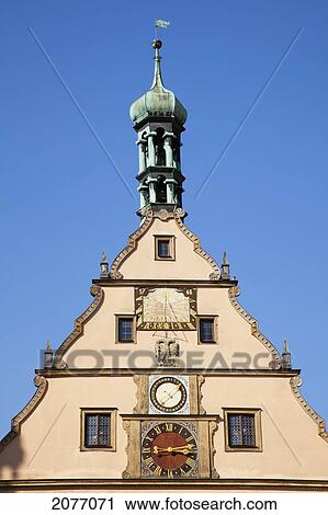 Peak Of A Building With A Clock Against A Blue Sky; Rothenburg Ob Der Tauber Bavaria Germany View Large Photo Image Stock Image - Peak Of A Building With A Clock Against A Blue Sky; Rothenburg Ob Der Tauber Bavaria Germany. Fotosearch