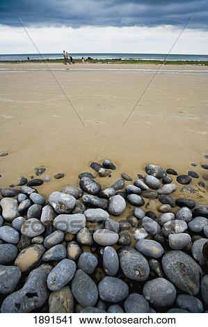 Stock Image - Pebble And Sand Split Beach. Fotosearch