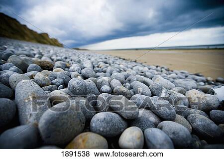 Stock Photo - Pebble And Sand Split Beach. Fotosearch
