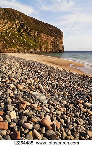 Pebble beach and cliffs along the coast, Rackwick; Orkney, Scotland View Large Photo Image Stock Photography - Pebble beach and cliffs along the coast, Rackwick; Orkney, Scotland. Fotosearch