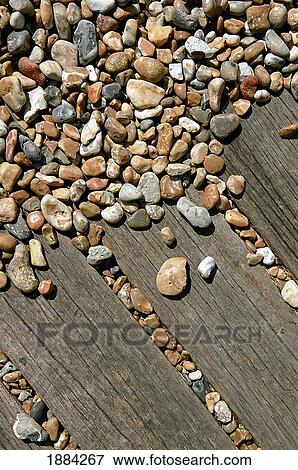 Pebbles And Wooden Boardwalk, Close Up View Large Photo Image Stock Photo - Pebbles And Wooden Boardwalk, Close Up. Fotosearch