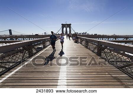 Stock Image - Pedestrian walkway on the Brooklyn Bridge, New York City, New York, United States. Fotosearch