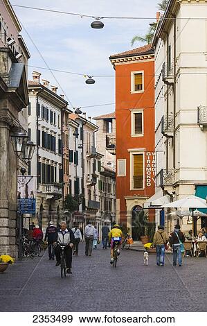 Stock Photo - Pedestrians And Cyclists In The Street; Verona, Italy. Fotosearch